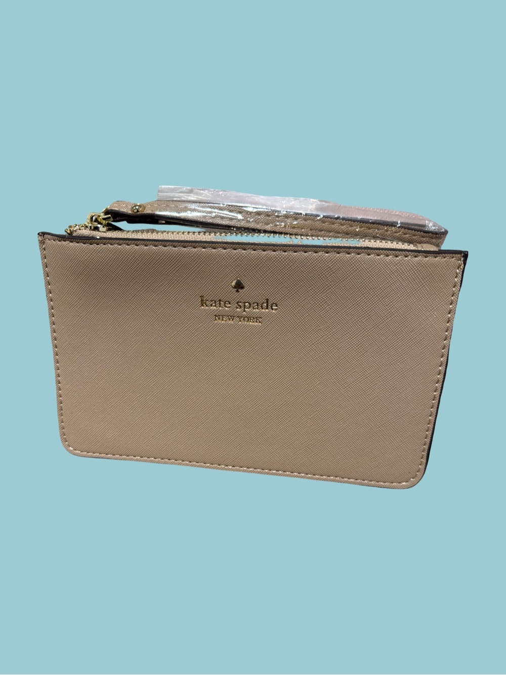 kate spade beige wristlet with gold logo
